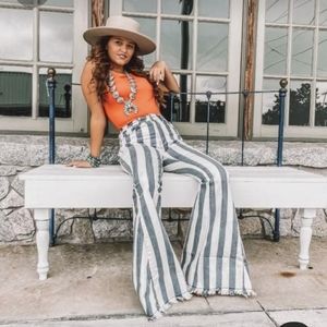Striped gray and white bell bottoms jeans.